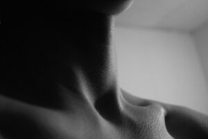Black and white photo of a human neck